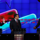 Then-Republican presidential candidates Donald Trump and Jeb Bush (right) respond to each other as Sen. Ted Cruz listens during the CNN Republican presidential debate on Dec. 15, 2015, in Las Vegas.